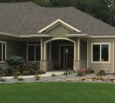 Front shot of home with green exterior siding
