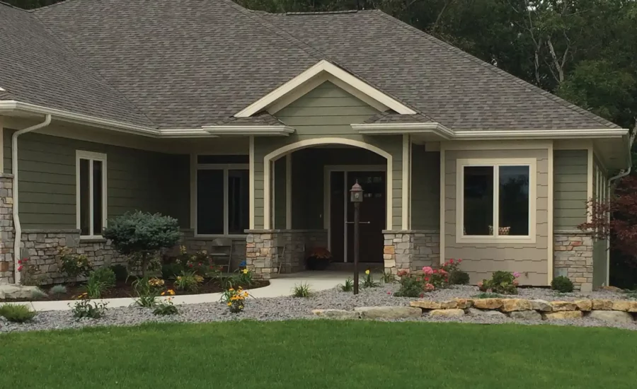 Front shot of home with green exterior siding