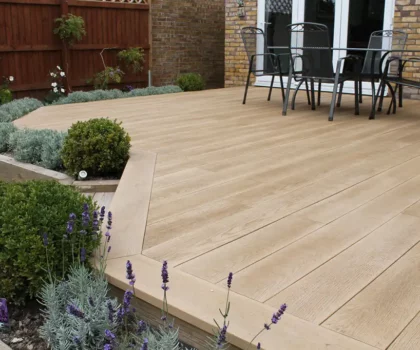 Deck designer: Light, low deck with small shrubbery as borders lined with decking material