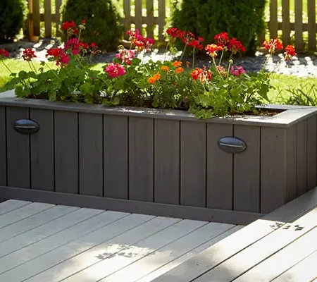 Deck ideas: Closeup of movable large brown planter made from fascia or riser boards