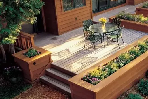 Deck designer: Large, wide planters serve as borders around the deck