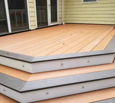 Light colored TimberTech decking with lights and trim