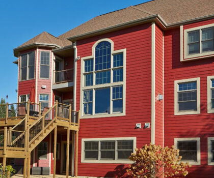 House with red Cinnabar Diamond Kote siding