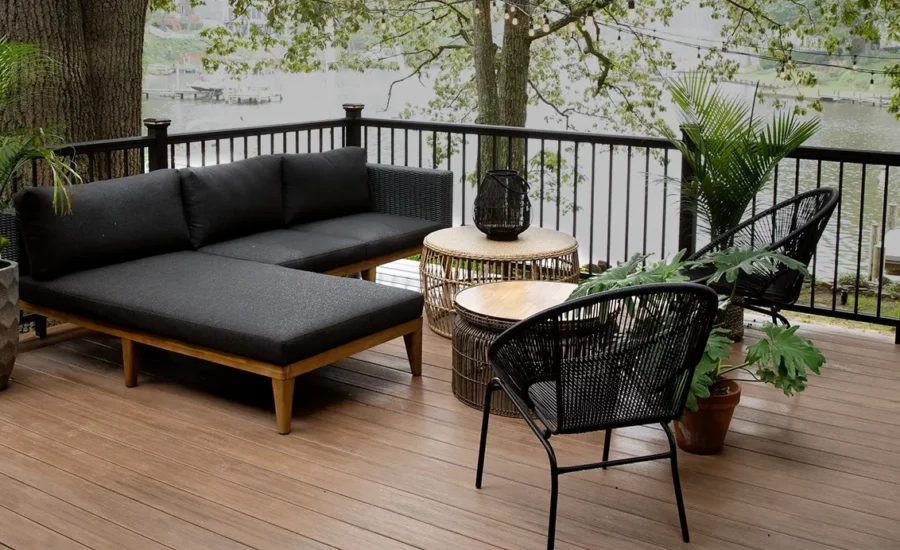 a waterfront deck under the shade of a tree