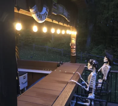 2 pirate skeletons seated at a bar