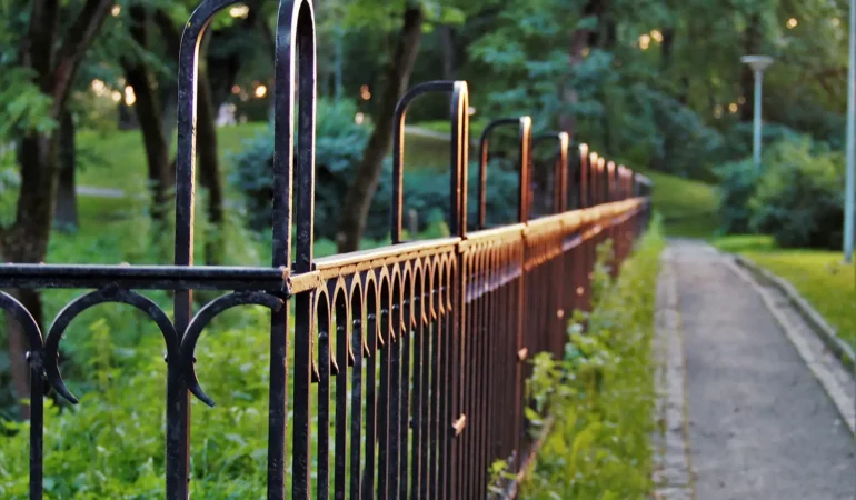A long run of beautiful, gothic fencing along a pathway