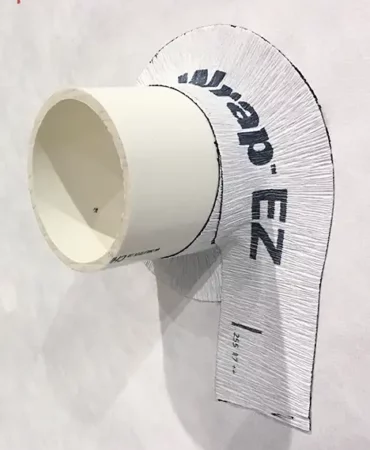 A PVC pipe protruding from wall, sealed with DuPont Tyvek FlexWrap EZ
