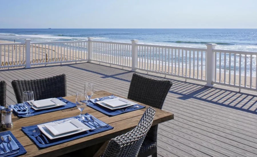 TimberTech Advanced PVC Harvest decking in slate gray along a seashore