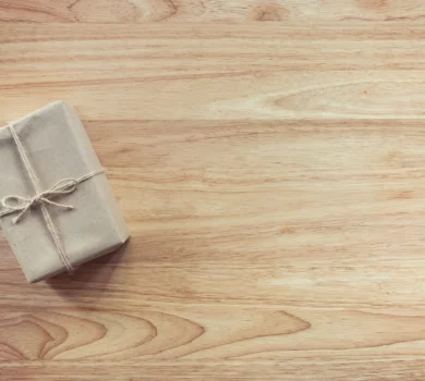 A gift package against a wood background