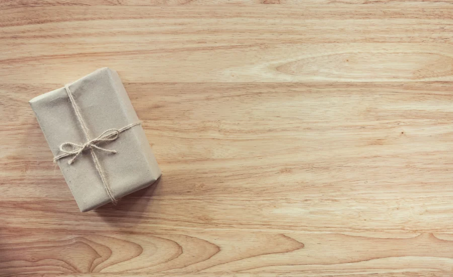 A gift package against a wood background