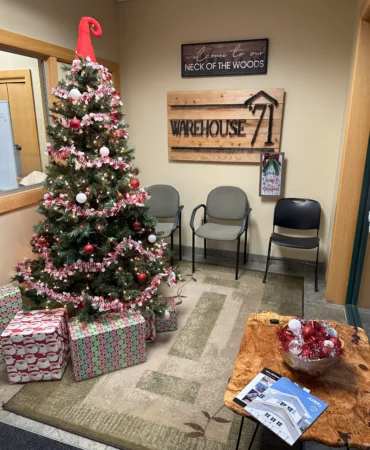 A warehouse decorated with a Christmas tree.