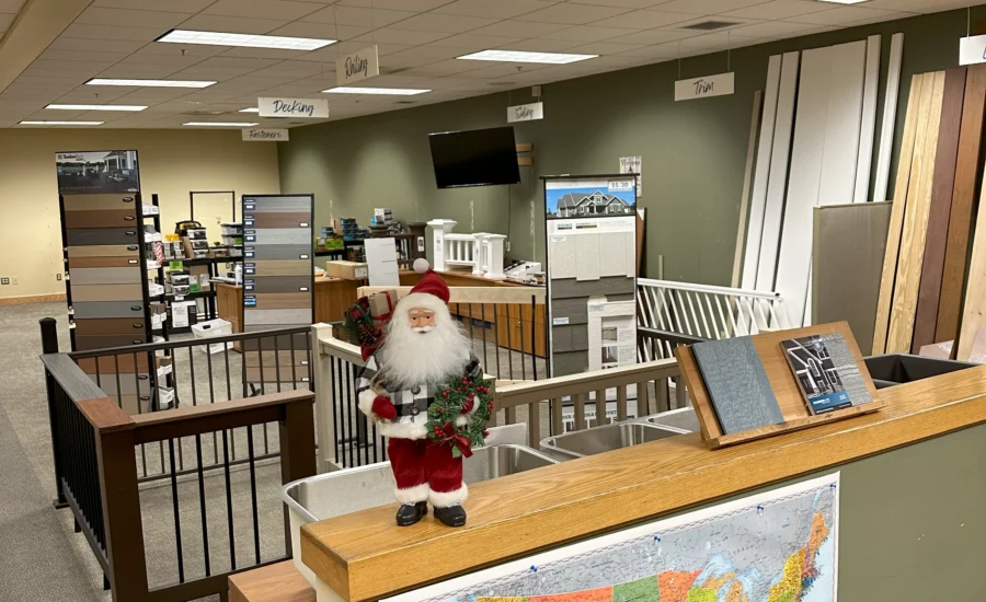 A showroom in a warehouse decorated for the holidays.