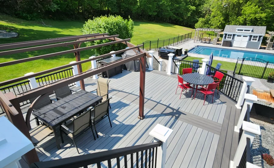 A gray Deckorators composite deck in the summertime.