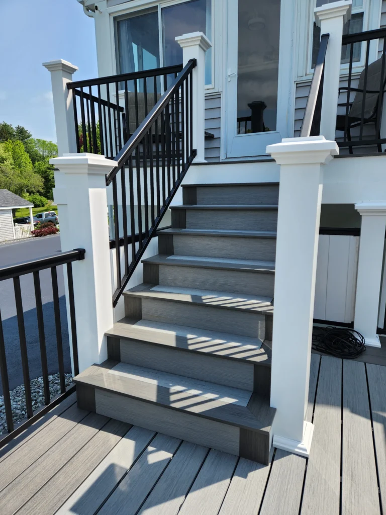 Gray Deckorators Composite Deck with black aluminum railing.