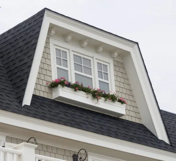 PVC trim around a window and flower box.