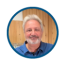 Warehouse '71 Online product expert standing in front of a wood wall